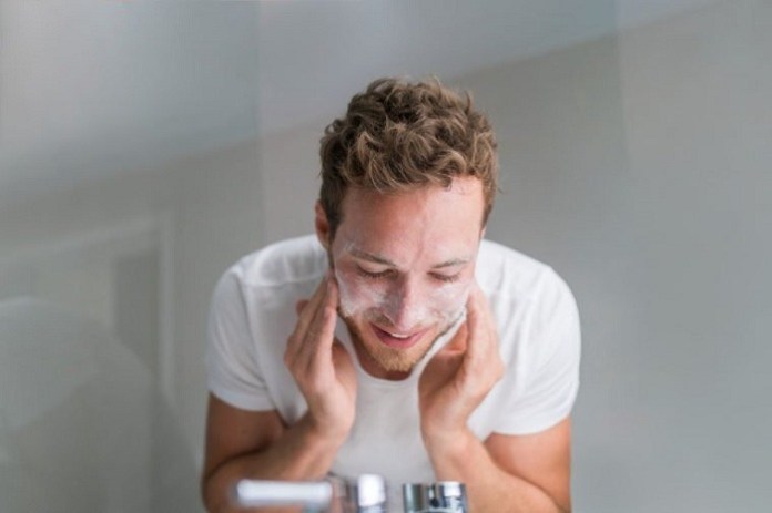 man applying Exfoliator