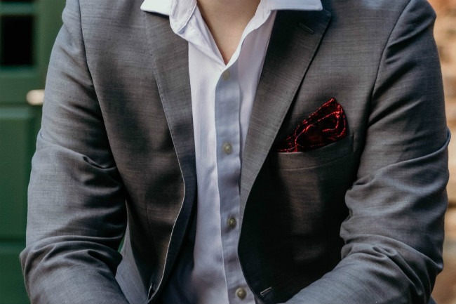 Clothes can change a first impression, like with this red pocket square.