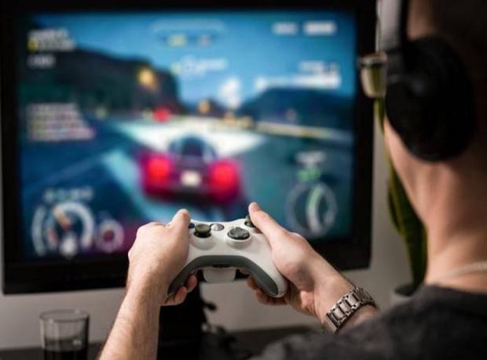 Man plays racing game